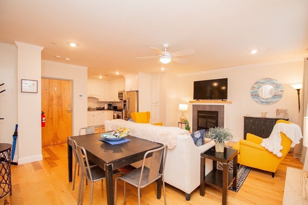 Dining room, Fireplace, Interior, Kitchen, Living room, Recessed Lighting, Stainless Steel Appliances, Wood Texture Flooring