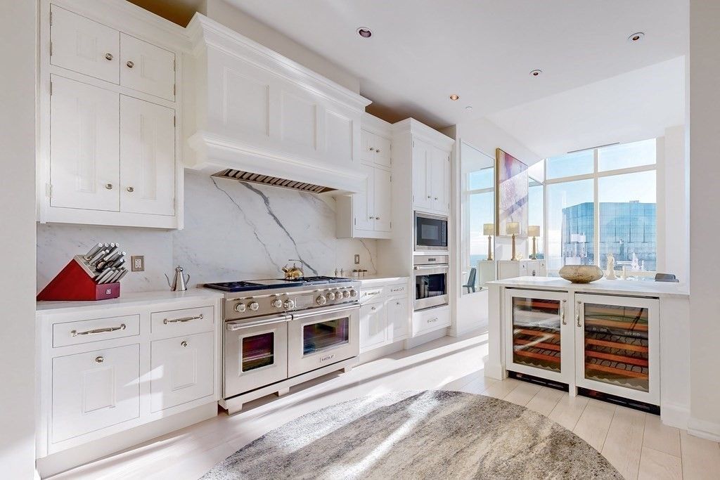 Interior, Kitchen, Marble Walls, Recessed Lighting, Stainless Steel Appliances, Wood Texture Flooring