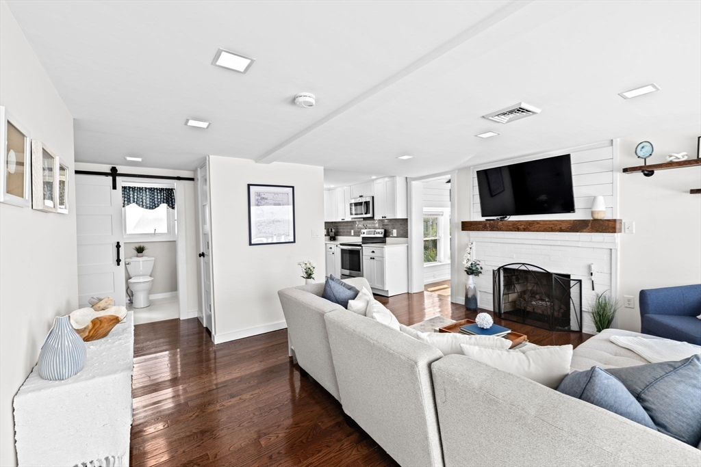 Fireplace, Interior, Kitchen, Living room, Recessed Lighting, Stainless Steel Appliances, Wood Texture Flooring