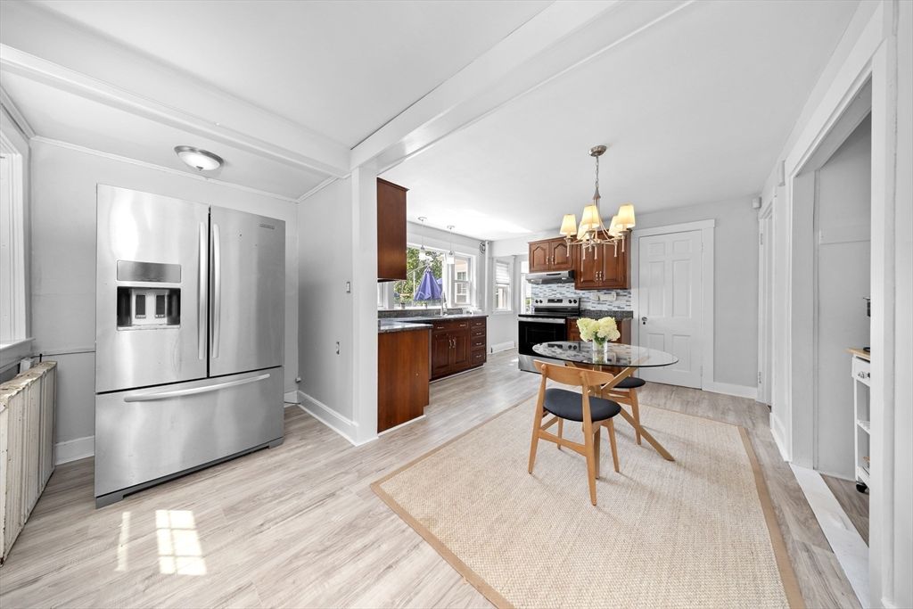 Chandelier, Dining room, Interior, Kitchen, Stainless Steel Appliances, Wood Texture Flooring