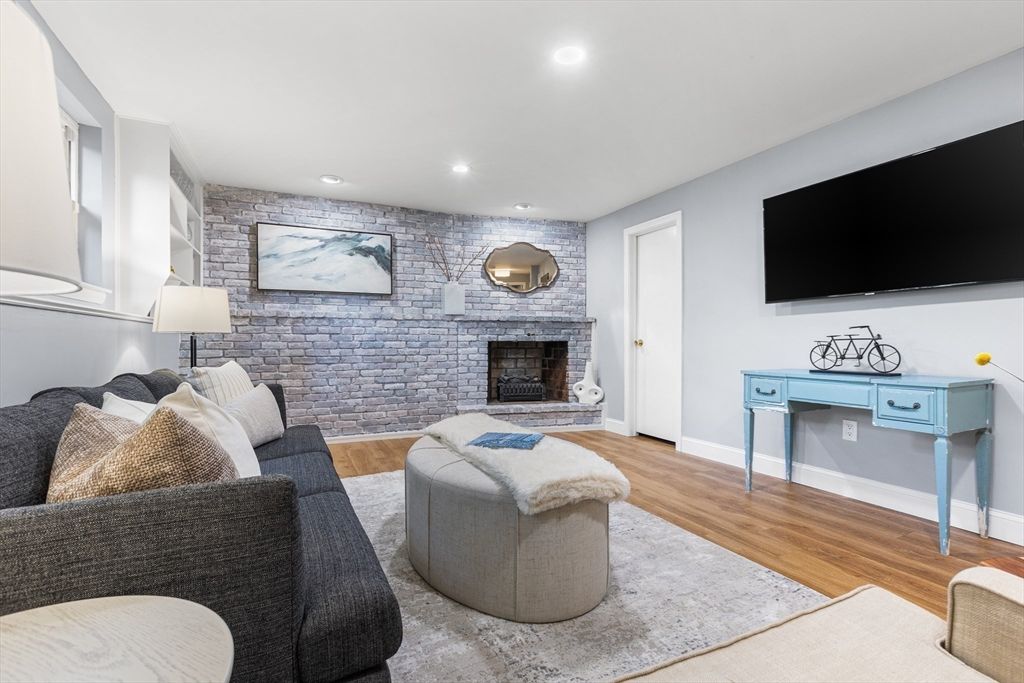Fireplace, Interior, Living room, Recessed Lighting, Stone Walls, Wood Texture Flooring