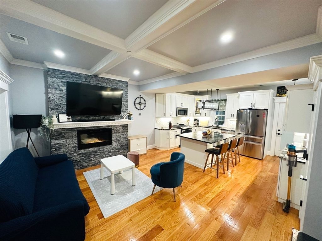 Fireplace, Interior, Kitchen, Living room, Pendant Lights, Recessed Lighting, Stainless Steel Appliances, Wood Texture Flooring