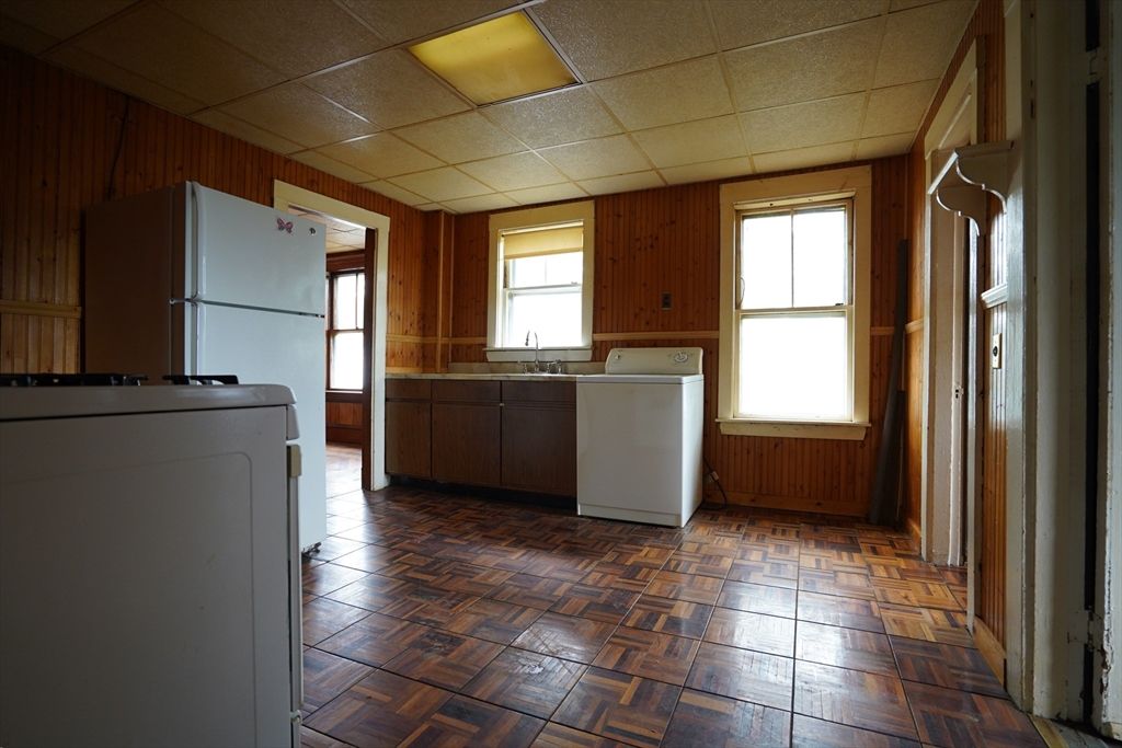 Interior, Kitchen, Washer, Wood Texture Flooring, Wooden Walls