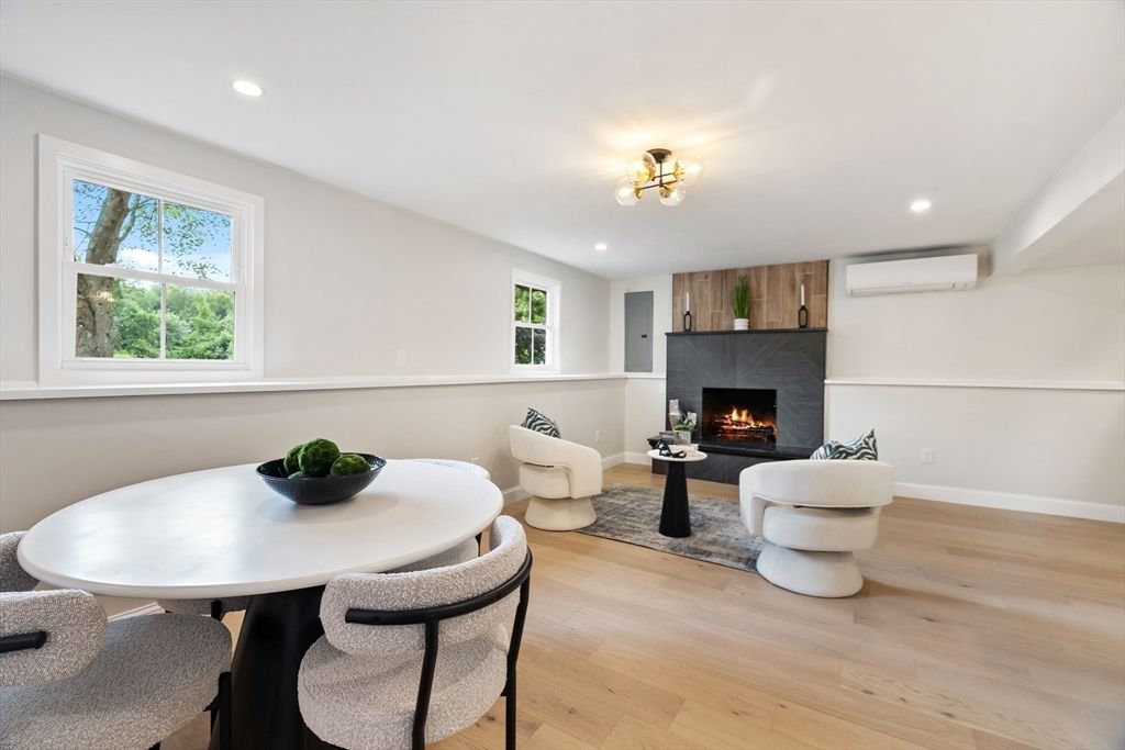 Dining room, Fireplace, Interior, Living room, Recessed Lighting, Wood Texture Flooring