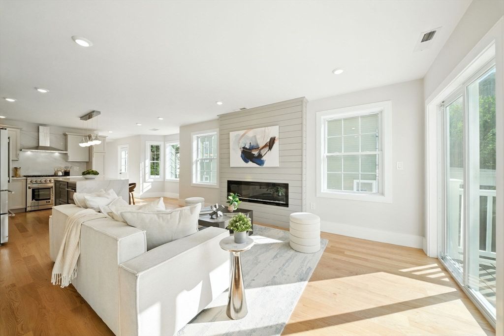 Fireplace, Interior, Kitchen, Living room, Pendant Lights, Recessed Lighting, Stainless Steel Appliances, Wood Texture Flooring