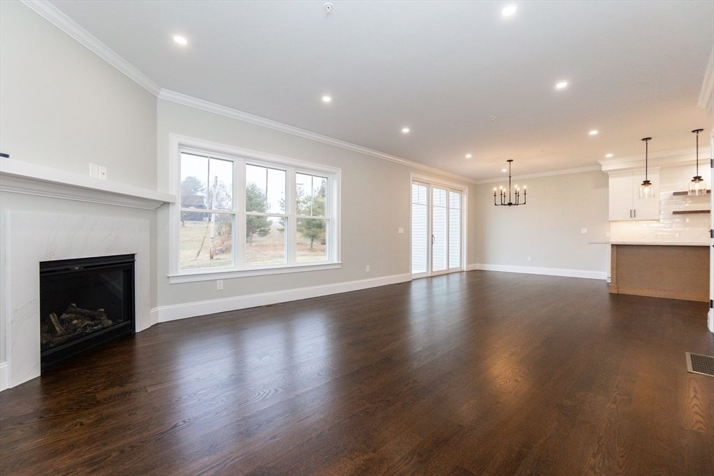 Empty room, Fireplace, Interior, Kitchen, Pendant Lights, Recessed Lighting, Wood Texture Flooring