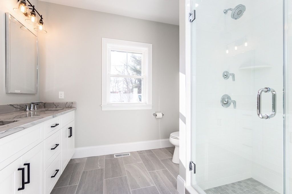 Bathroom, Dual Sink Vanities, Glass Shower, Interior, Wood Texture Flooring
