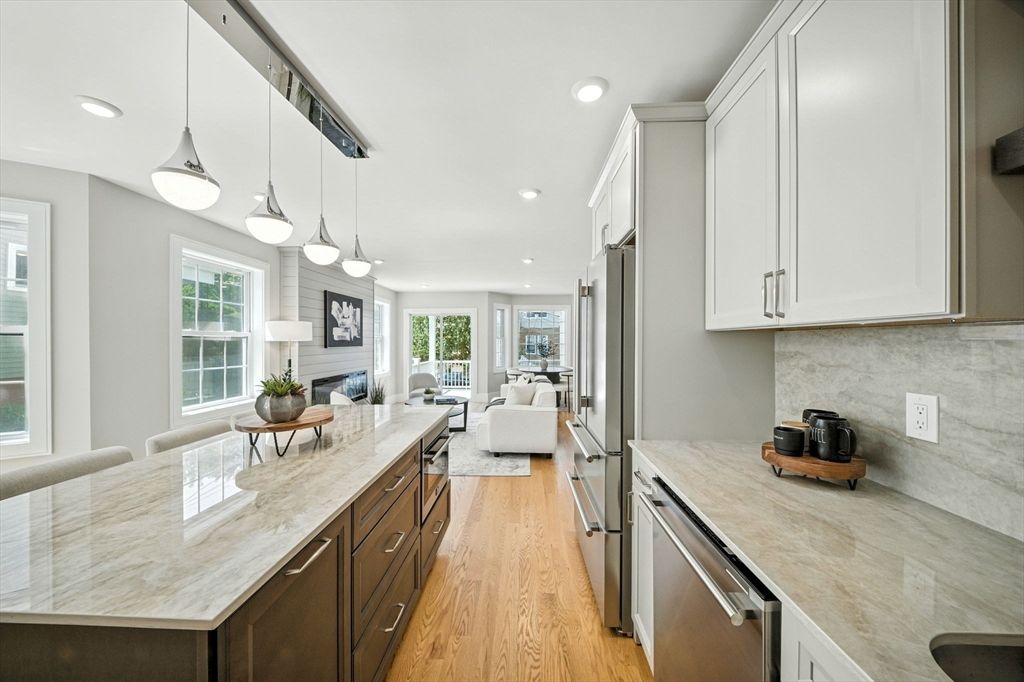 Fireplace, Interior, Kitchen, Living room, Pendant Lights, Recessed Lighting, Stainless Steel Appliances, Wood Texture Flooring