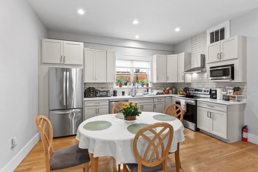 Dining room, Interior, Kitchen, Recessed Lighting, Stainless Steel Appliances, Wood Texture Flooring