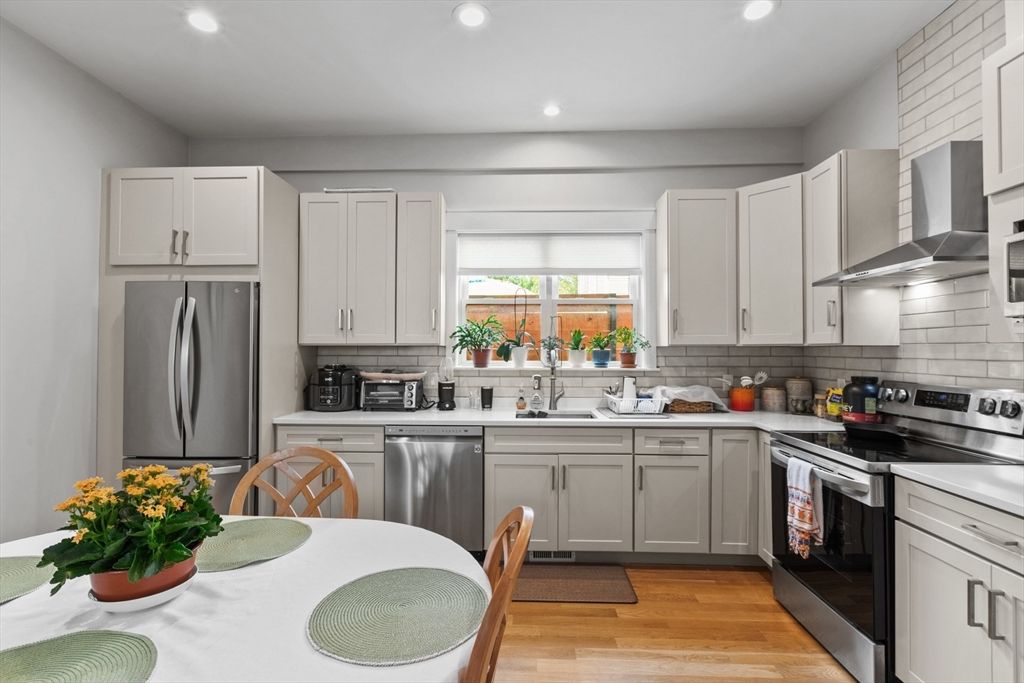 Dining room, Interior, Kitchen, Recessed Lighting, Stainless Steel Appliances, Wood Texture Flooring