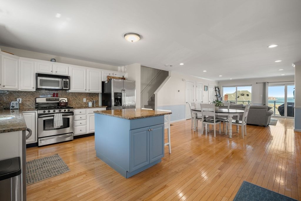Dining room, Interior, Kitchen, Living room, Recessed Lighting, Stainless Steel Appliances, Wood Texture Flooring