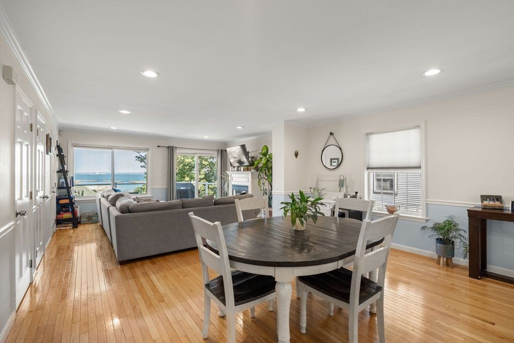 Dining room, Fireplace, Interior, Living room, Recessed Lighting, Water, Wood Texture Flooring