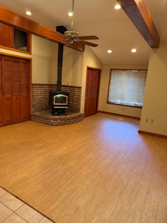 Empty room, Fireplace, Interior, Recessed Lighting, Stone Walls, Wood Texture Flooring