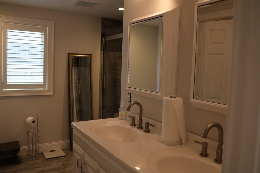 Bathroom, Dual Sink Vanities, Glass Shower, Interior, Recessed Lighting, Wood Texture Flooring