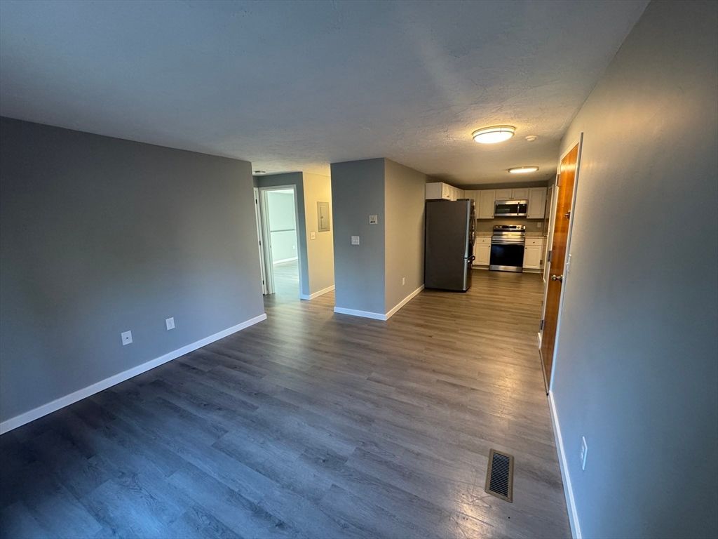 Empty room, Interior, Kitchen, Stainless Steel Appliances, Wood Texture Flooring