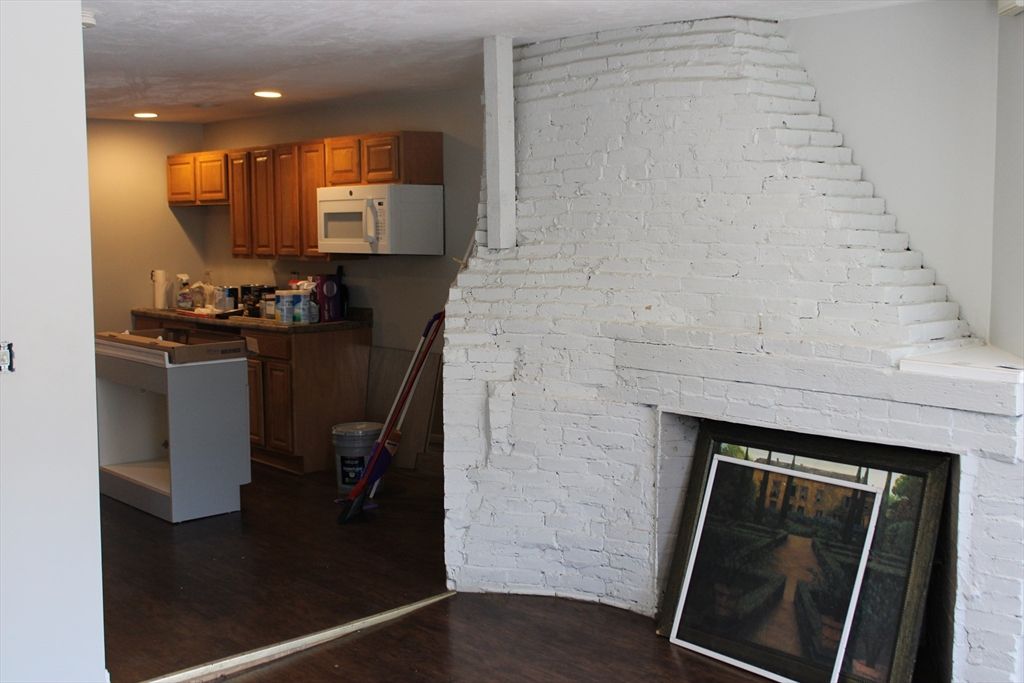 Fireplace, Interior, Kitchen, Recessed Lighting, Stone Walls, Wood Texture Flooring