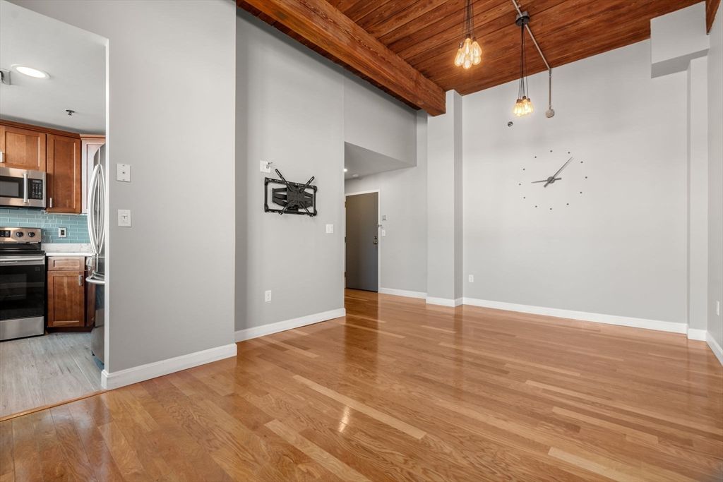 Empty room, Interior, Kitchen, Pendant Lights, Recessed Lighting, Stainless Steel Appliances, Wooden Ceilings, Wood Texture Flooring