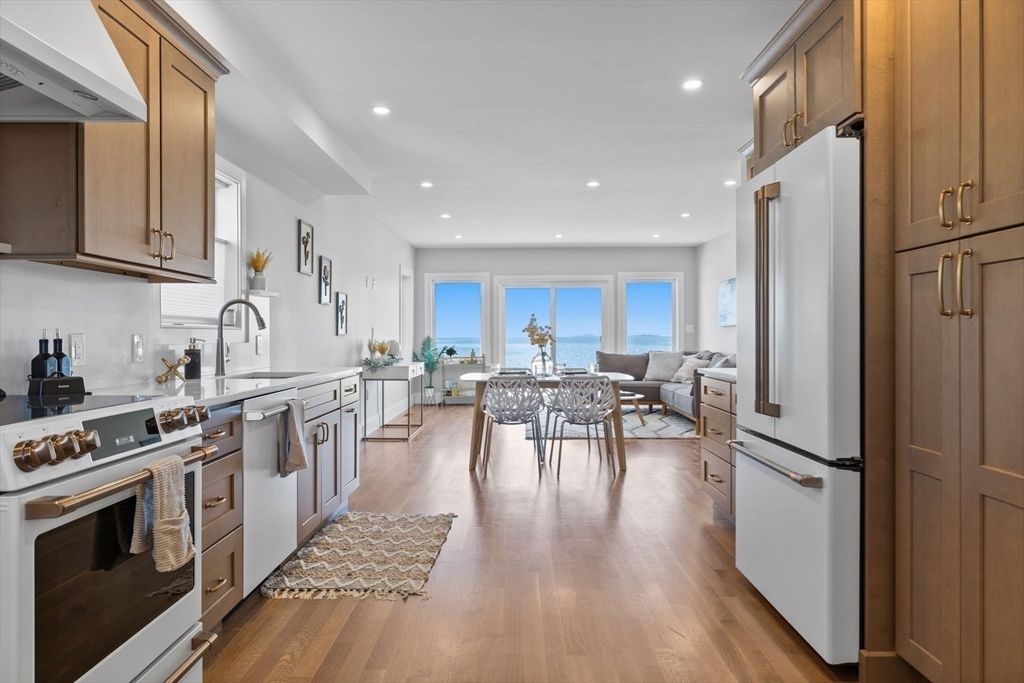 Dining room, Interior, Kitchen, Living room, Recessed Lighting, Stainless Steel Appliances, Water, Wood Texture Flooring
