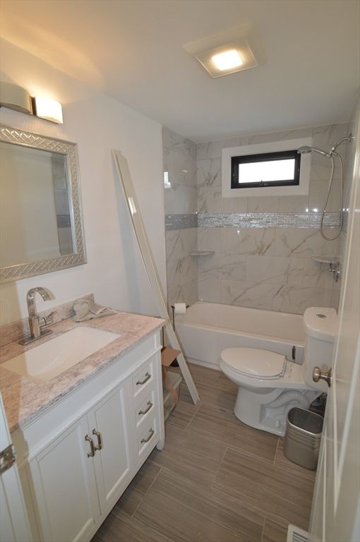 Bathroom, Dual Sink Vanities, Interior, Marble Walls, Wood Texture Flooring
