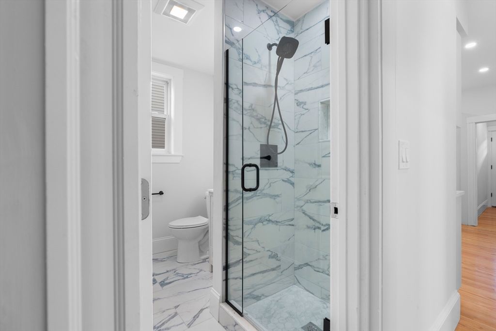 Bathroom, Glass Shower, Interior, Marble, Marble Walls, Recessed Lighting, Wood Texture Flooring