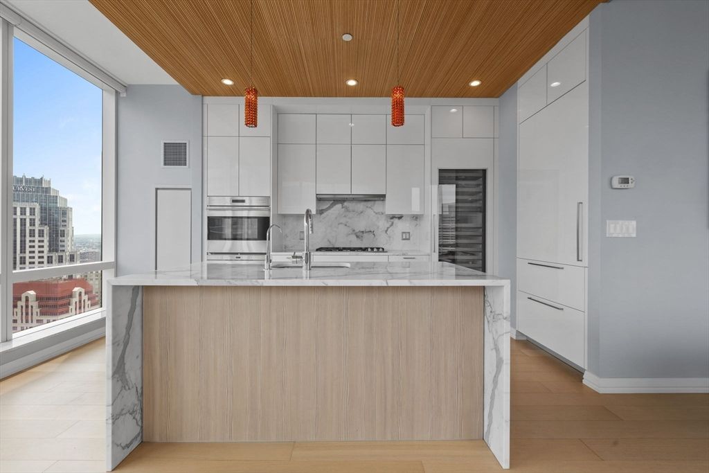 Interior, Kitchen, Marble Walls, Pendant Lights, Recessed Lighting, Stainless Steel Appliances, Wooden Ceilings, Wood Texture Flooring