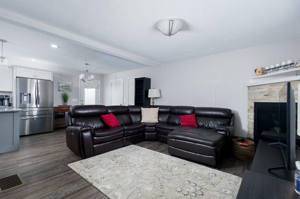 Fireplace, Interior, Kitchen, Living room, Pendant Lights, Recessed Lighting, Stainless Steel Appliances, Wood Texture Flooring