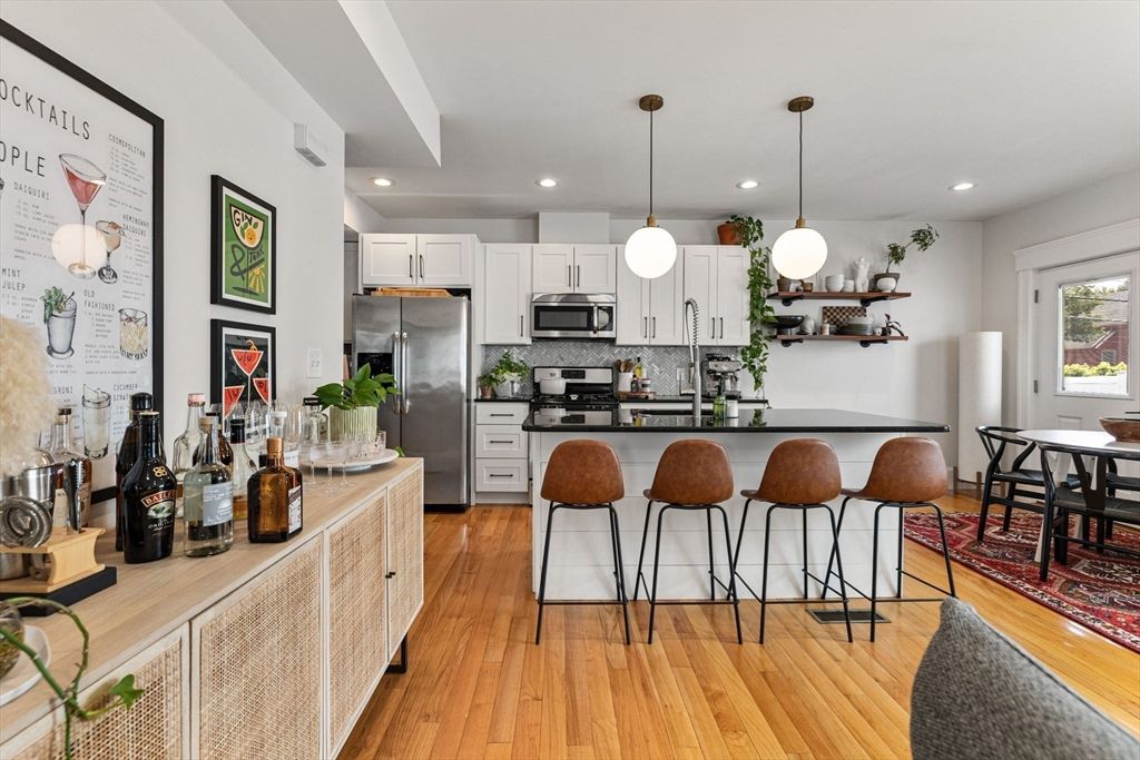 Dining room, Interior, Kitchen, Pendant Lights, Recessed Lighting, Stainless Steel Appliances, Wood Texture Flooring