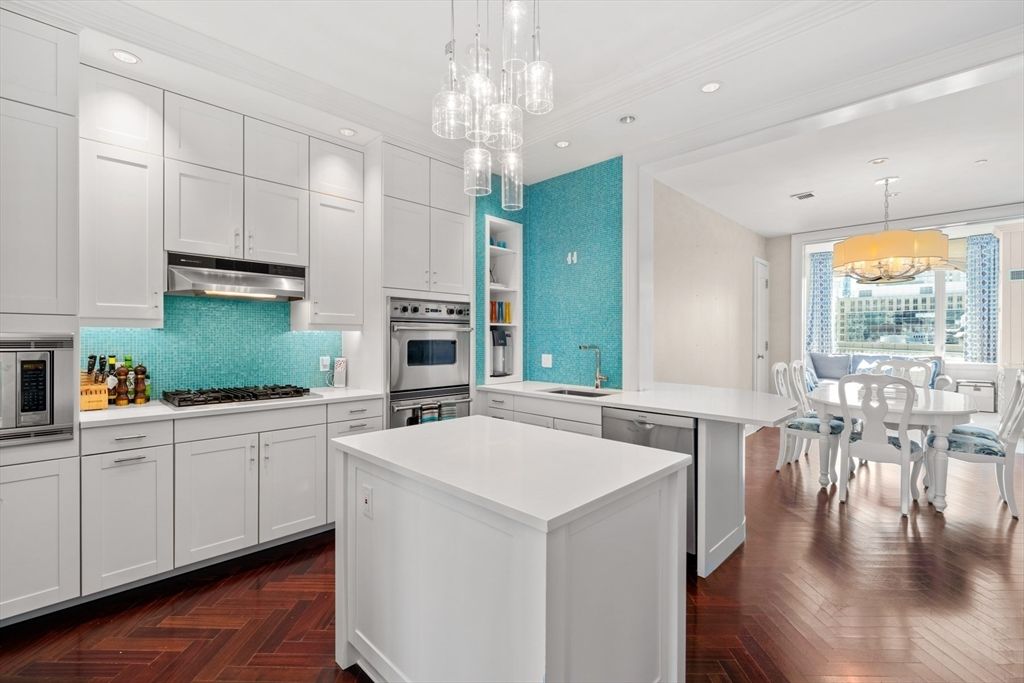 Chandelier, Dining room, Interior, Kitchen, Pendant Lights, Recessed Lighting, Stainless Steel Appliances, Wood Texture Flooring