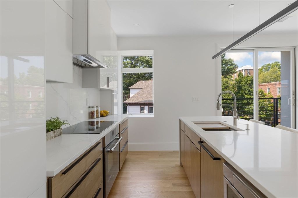 Interior, Kitchen, Marble Walls, Pendant Lights, Recessed Lighting, Wood Texture Flooring