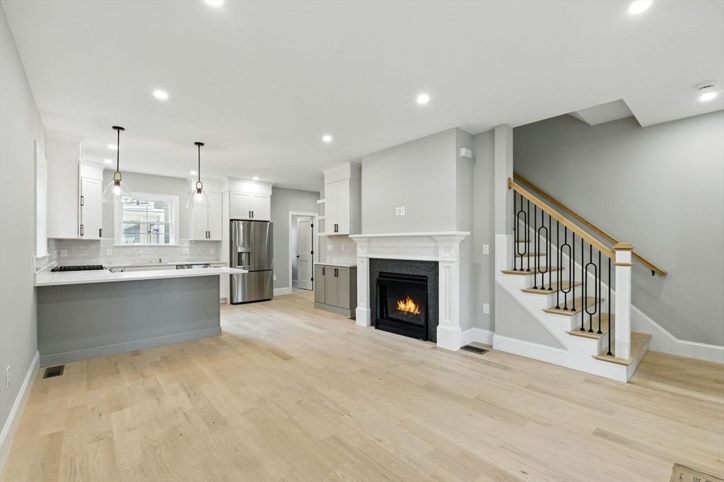 Fireplace, Interior, Kitchen, Pendant Lights, Recessed Lighting, Stainless Steel Appliances, Wood Texture Flooring