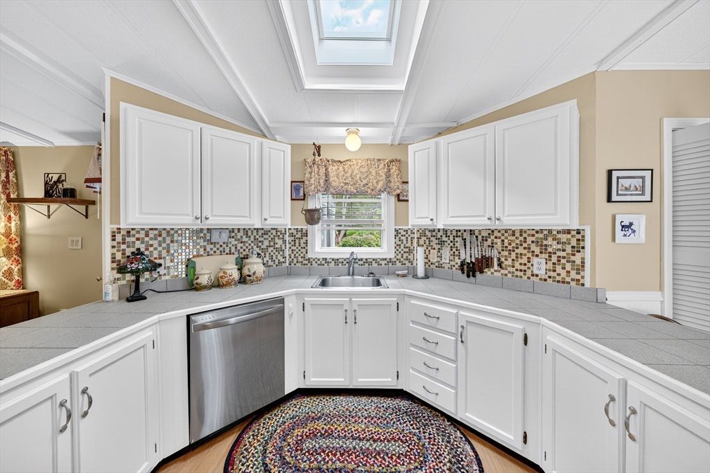 Interior, Kitchen, Stainless Steel Appliances, Tile Countertops, Wood Texture Flooring