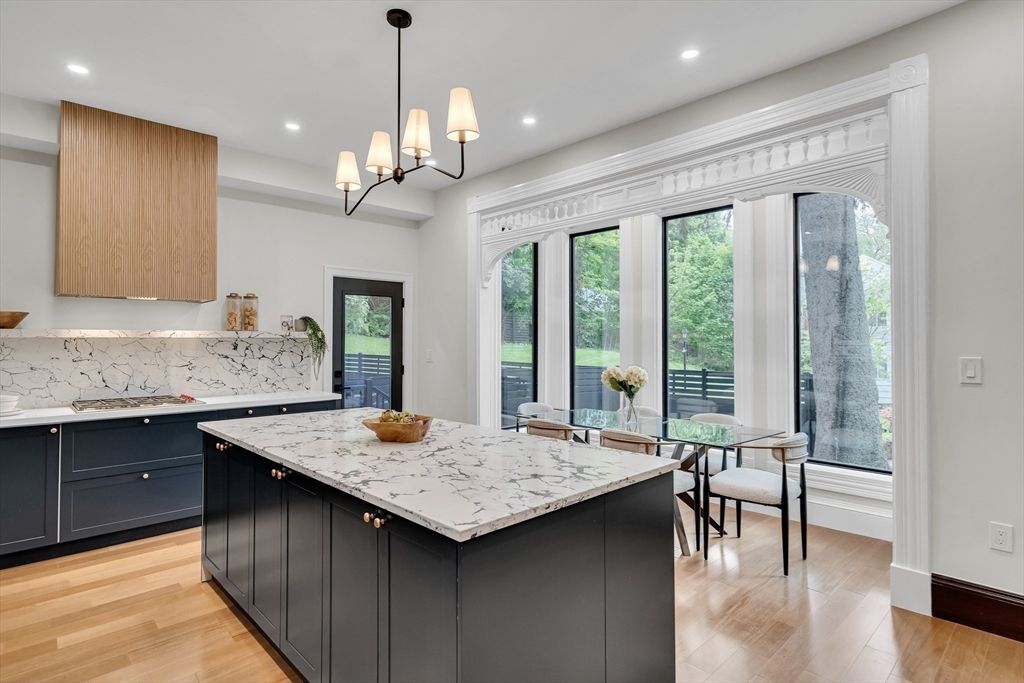 Chandelier, Dining room, Interior, Kitchen, Marble Walls, Pendant Lights, Recessed Lighting, Wood Texture Flooring