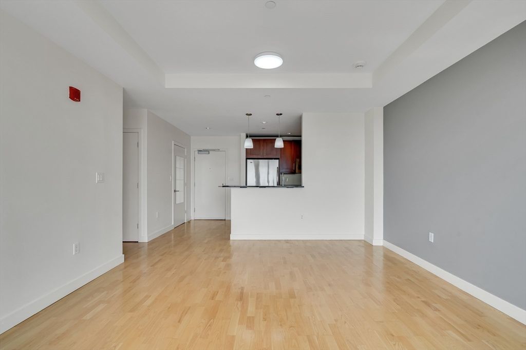Empty room, Interior, Kitchen, Pendant Lights, Stainless Steel Appliances, Wood Texture Flooring
