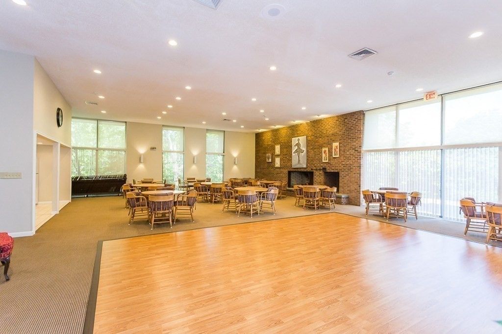 Dining room, Fireplace, Interior, Recessed Lighting, Stone Walls, Wood Texture Flooring