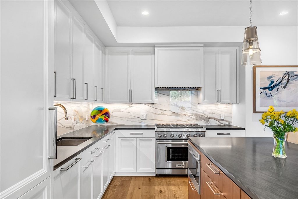 Interior, Kitchen, Marble Walls, Pendant Lights, Recessed Lighting, Stainless Steel Appliances, Wood Texture Flooring