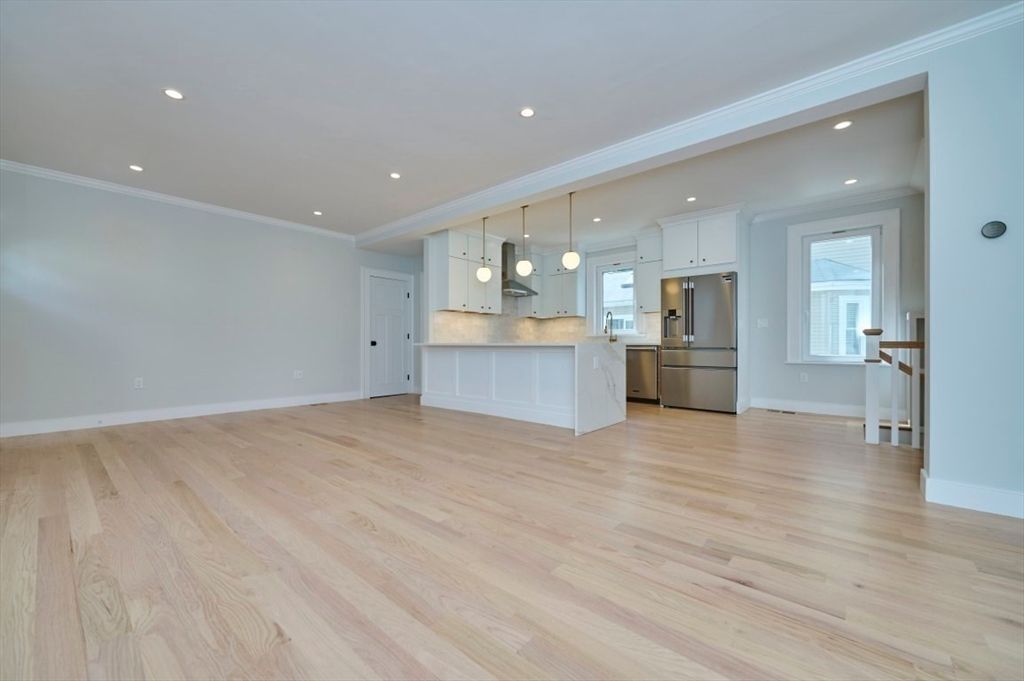 Empty room, Interior, Kitchen, Pendant Lights, Recessed Lighting, Stainless Steel Appliances, Wood Texture Flooring