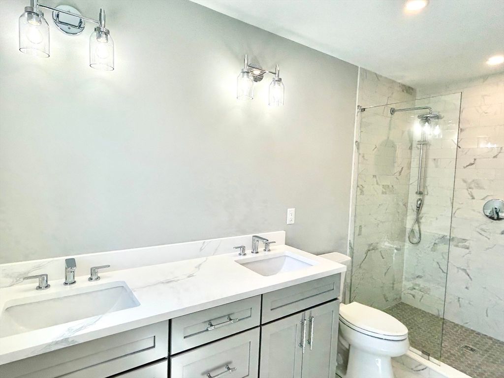 Bathroom, Dual Sink Vanities, Glass Shower, Interior, Marble Walls, Recessed Lighting