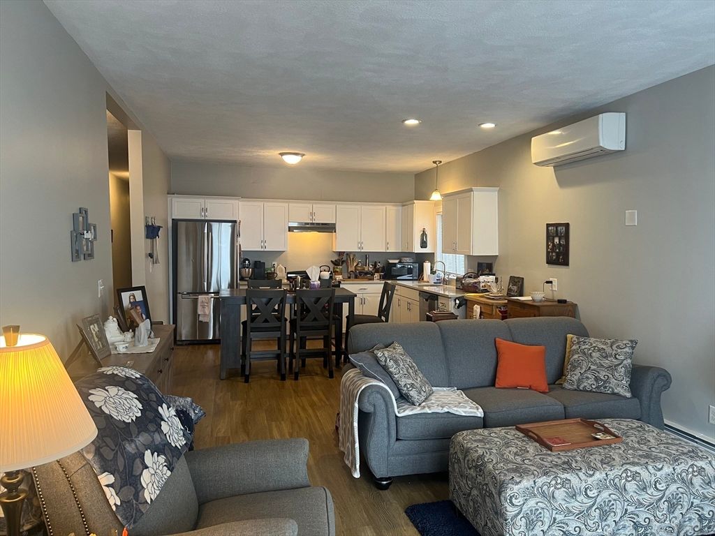 Dining room, Interior, Kitchen, Living room, Recessed Lighting, Stainless Steel Appliances, Wood Texture Flooring