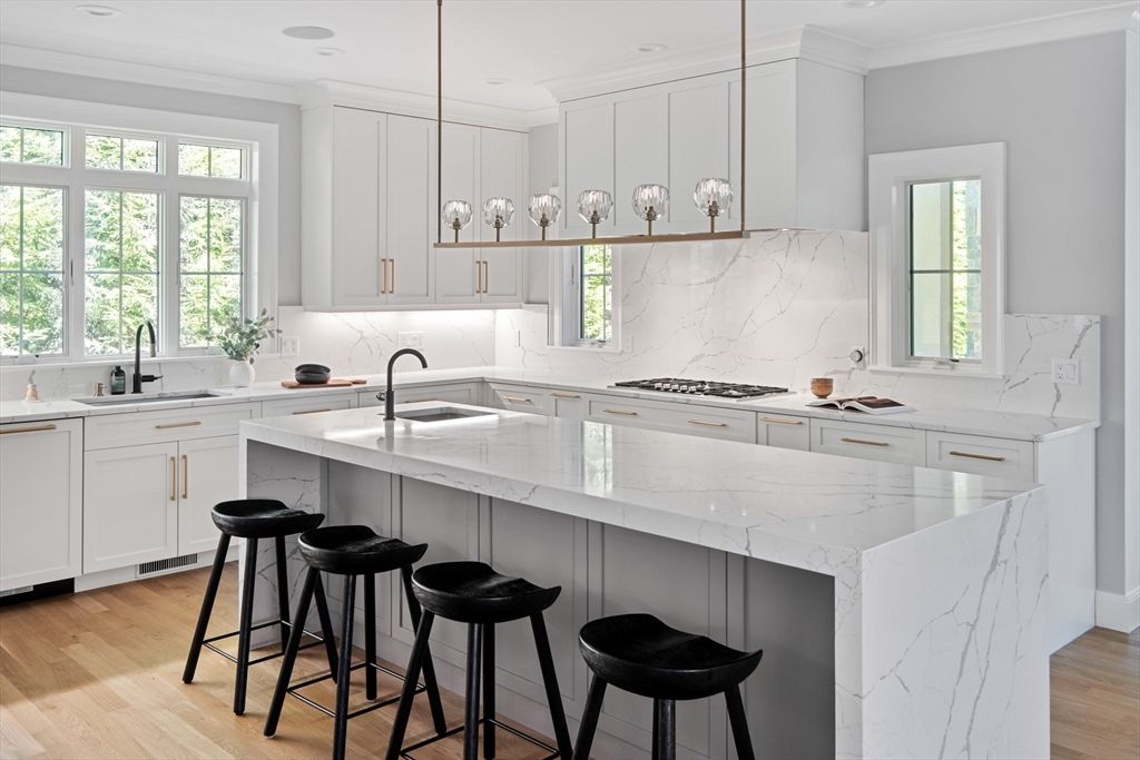 Interior, Kitchen, Marble Walls, Pendant Lights, Recessed Lighting, Stainless Steel Appliances, Wood Texture Flooring