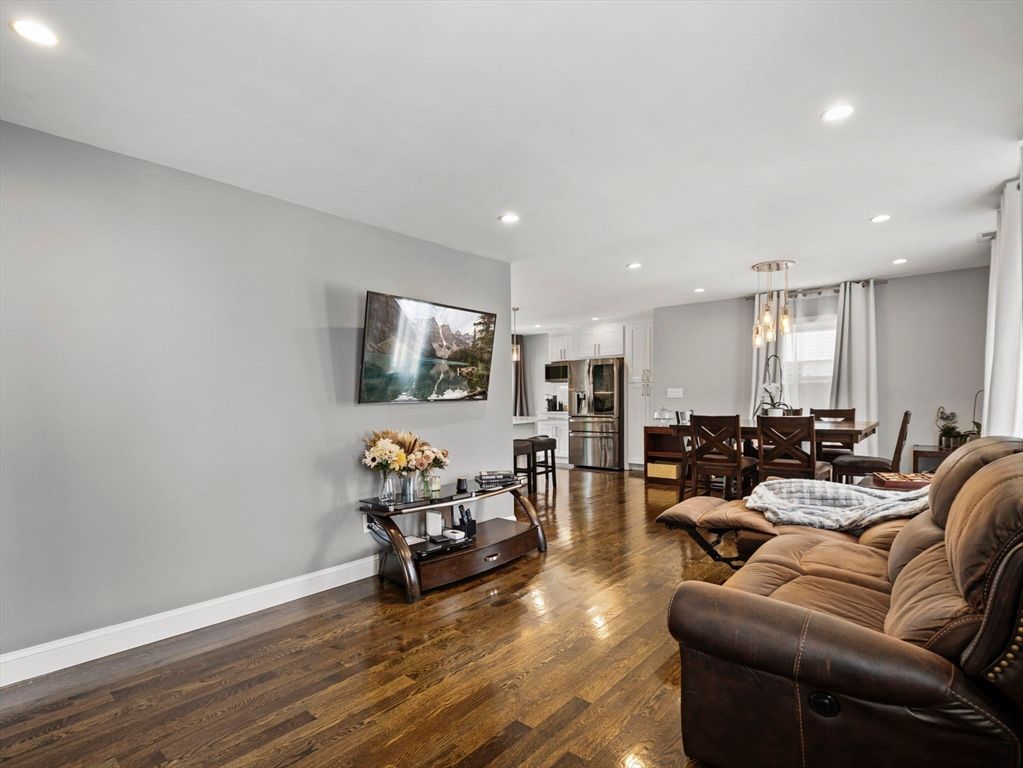 Chandelier, Dining room, Interior, Kitchen, Living room, Pendant Lights, Recessed Lighting, Stainless Steel Appliances, Wood Texture Flooring