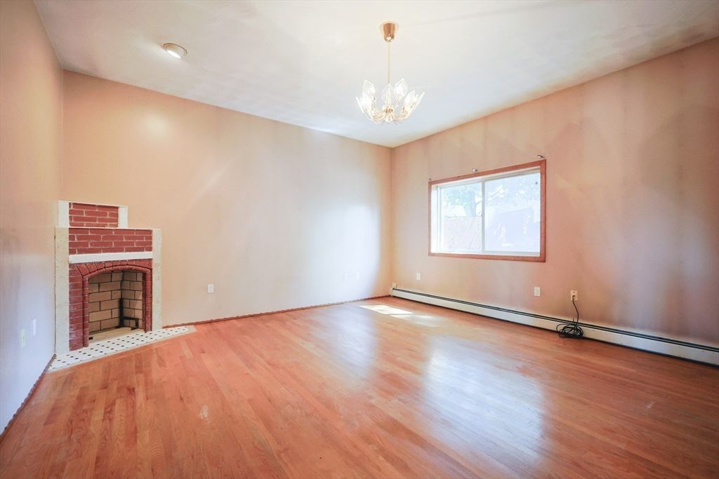 Empty room, Fireplace, Interior, Pendant Lights, Recessed Lighting, Wood Texture Flooring