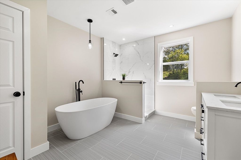 Bathroom, Dual Sink Vanities, Free Standing Baths, Interior, Marble Walls, Pendant Lights, Recessed Lighting