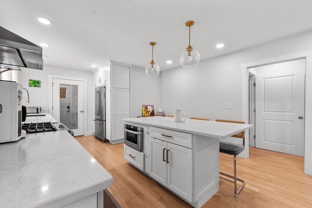 Interior, Kitchen, Pendant Lights, Recessed Lighting, Stainless Steel Appliances, Wood Texture Flooring