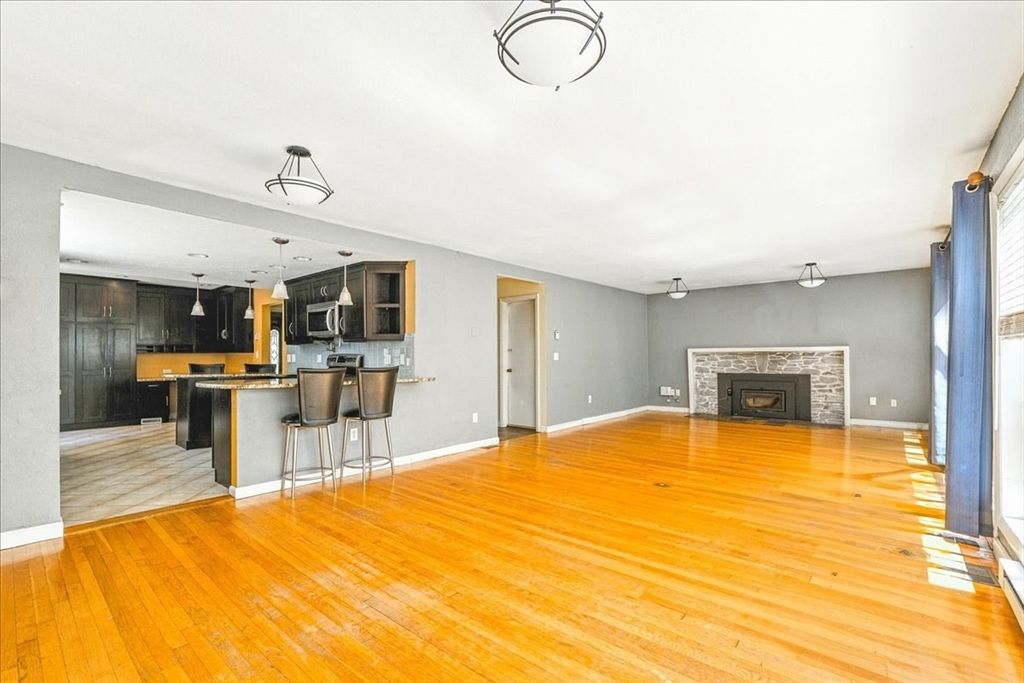 Empty room, Fireplace, Interior, Kitchen, Pendant Lights, Wood Texture Flooring