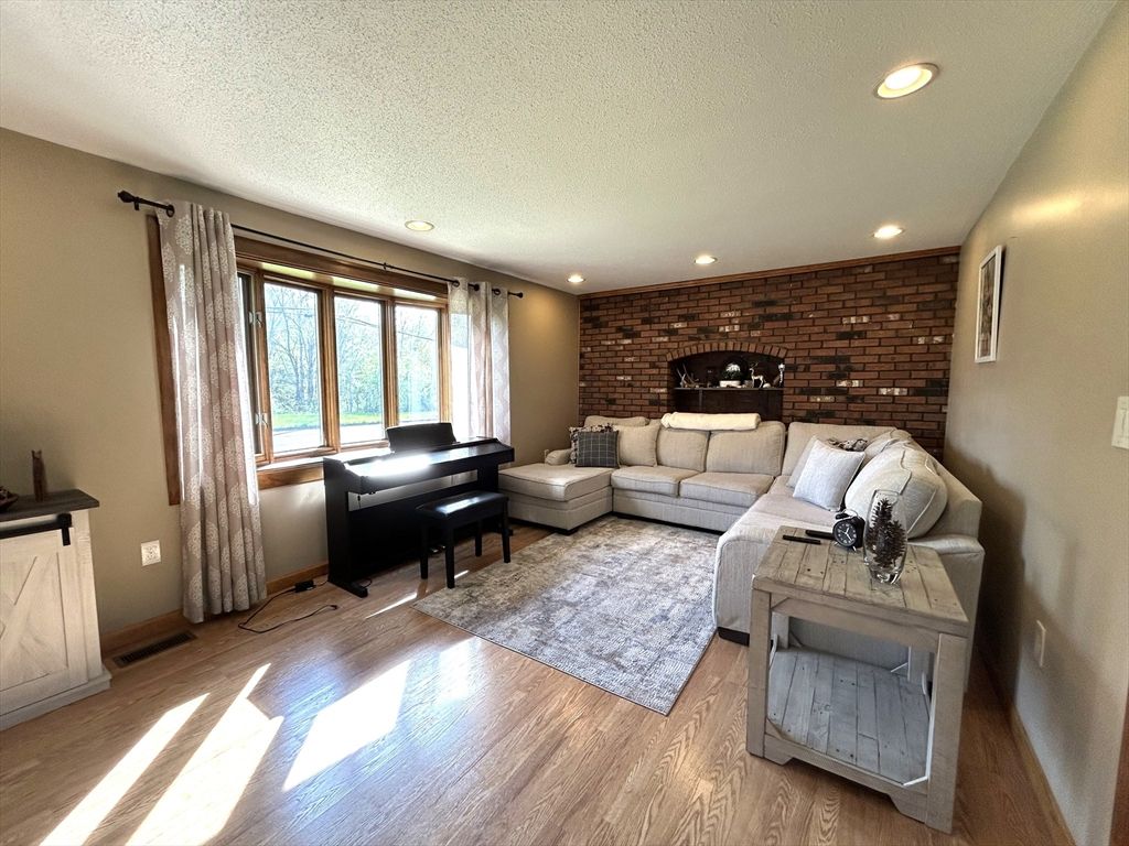 Interior, Living room, Piano, Recessed Lighting, Stone Walls, Wood Texture Flooring