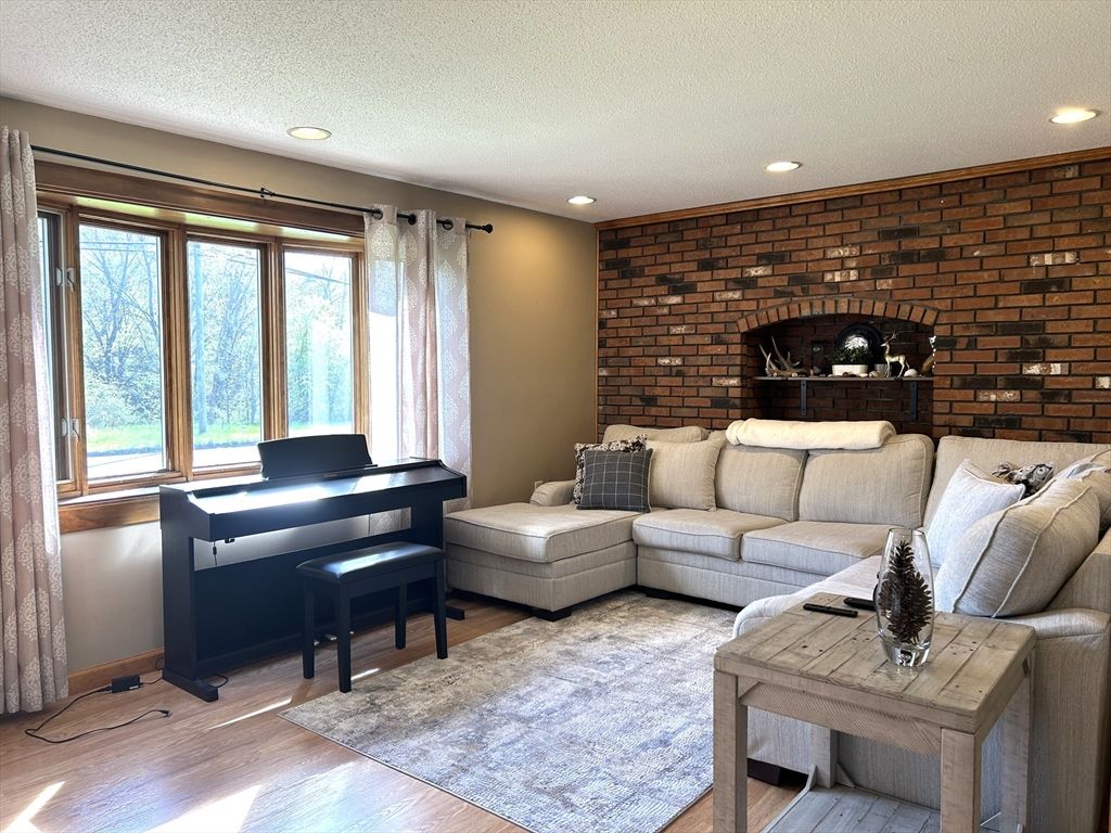Interior, Living room, Piano, Recessed Lighting, Stone Walls, Wood Texture Flooring