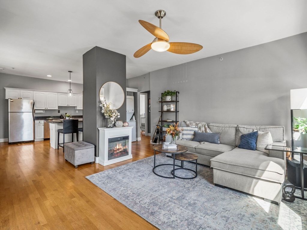 Fireplace, Interior, Kitchen, Living room, Pendant Lights, Recessed Lighting, Stainless Steel Appliances, Wood Texture Flooring