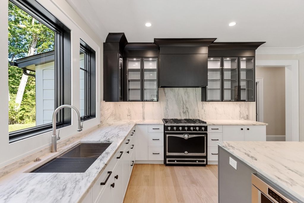 Interior, Kitchen, Marble Walls, Recessed Lighting, Stainless Steel Appliances, Wood Texture Flooring