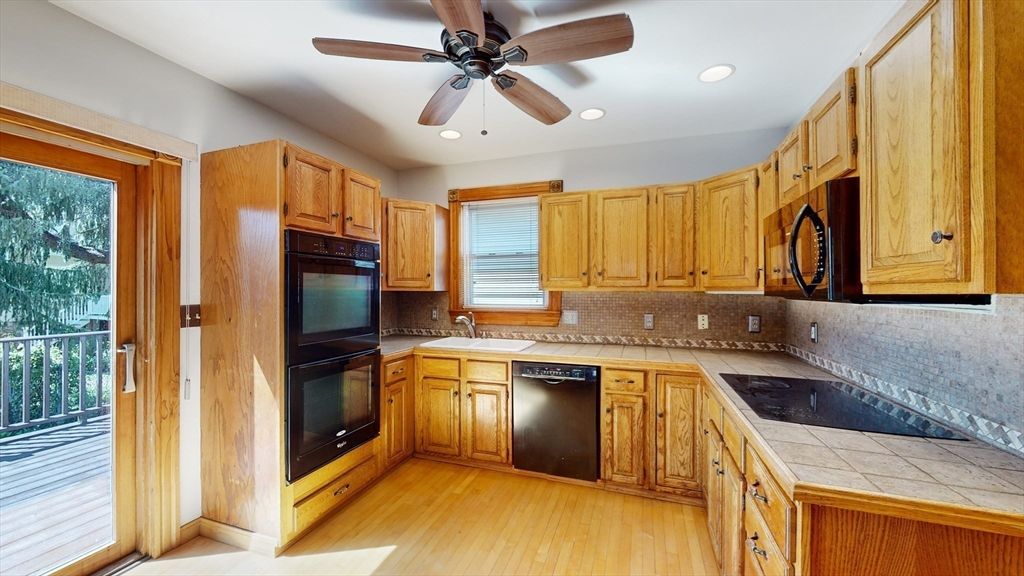 Interior, Kitchen, Recessed Lighting, Tile Countertops, Wood Texture Flooring
