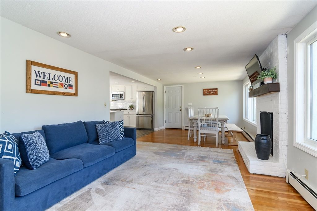 Dining room, Fireplace, Interior, Kitchen, Living room, Recessed Lighting, Stainless Steel Appliances, Wood Texture Flooring